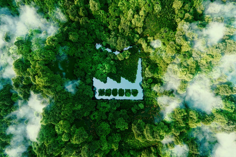 A factory-shaped pond in a forest, a panorama view, representing that Wetend Technologies makes paper production more sustainable with TrumpJet flash mixing